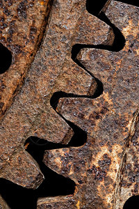 车轮老的两种相互连接钢旋轮非常古老生锈近身拍摄工业抽象和老式生锈的旋轮质地图片