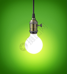 电的闪亮力量绿色背景旧灯泡图片