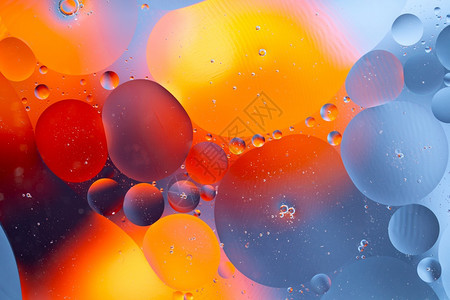液体水油混合产生的抽象背景水油混合产生的抽象背景黄色装饰图片