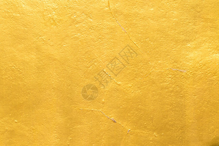 金子水泥墙纹理背景上的金漆水平颜色图片