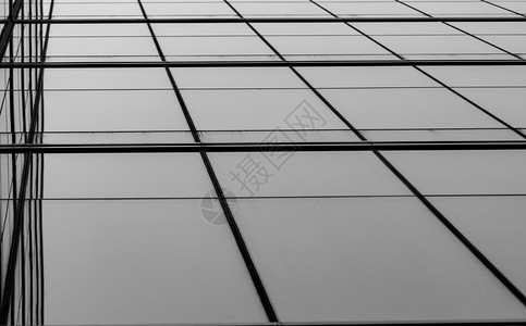 城市镜子正面现代未来主义玻璃建筑抽象背景的透视图办公玻璃建筑外部在商业透明玻璃中的反射公司玻璃窗图片