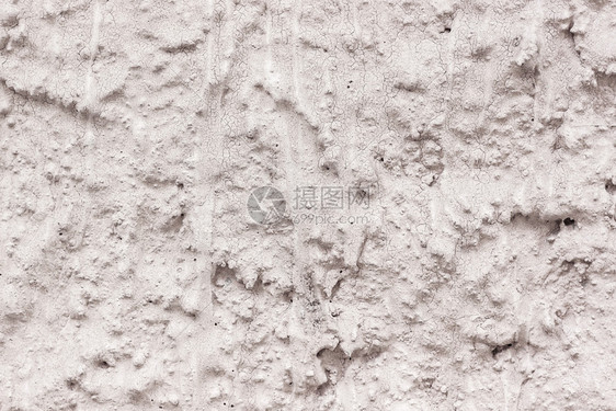 材料浅褐色的城市粗略石膏混凝土墙上裂缝图片