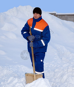 连体工作服活动冬季西装工人包括雪下背景的夹克和长裤子套装图片