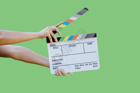 手持电影片板颜色供电影院和视业绿色背景的电影和视业使用保持镜头隔板背景图片