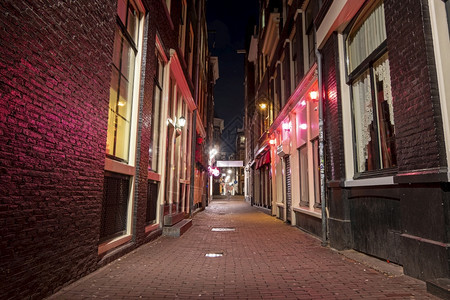 发光的荷兰阿姆斯特丹红灯区晚上到荷兰妓院黄昏图片