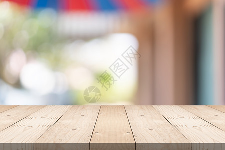 现代的棕色空木板顶在购物商场的模糊背景上复制您产品的补假空间桌面图片
