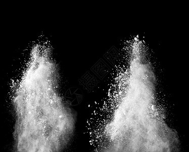白色粉末在暗底背景爆炸的冻结运动溅飞抽象的图片