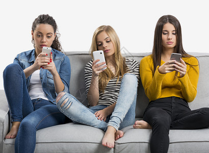 社会的在家使用手机少女节日孩移动的背景图片