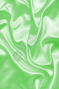 平滑优雅的绿色丝绸或纹质可用作背景豪华丝滑或者图片
