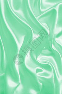 平滑优雅的绿色丝绸或纹质可用作背景精美的投标光滑图片