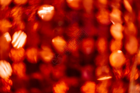 带有复制空间和内嵌图案的红色bokeh背景发光的有质感星图片