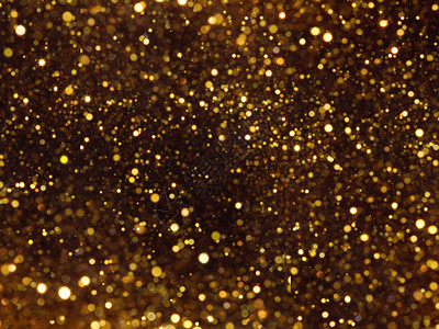 奢华闪发光带有bokeh效果的金光色上覆背景包括复制空间夜晚图片