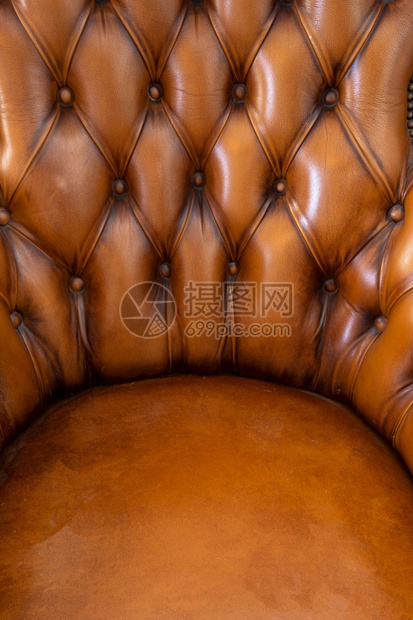 抽象的织物BrownChchesterfield风格皮革抽象背景纹理手椅关闭现代设计室内装潢图片