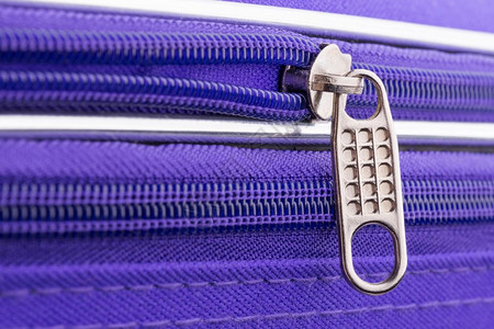 金属瓜拉纳皮抽象的显示拉链标签和紫外线手提箱链的连锁拉宏准备安全度假旅行图片
