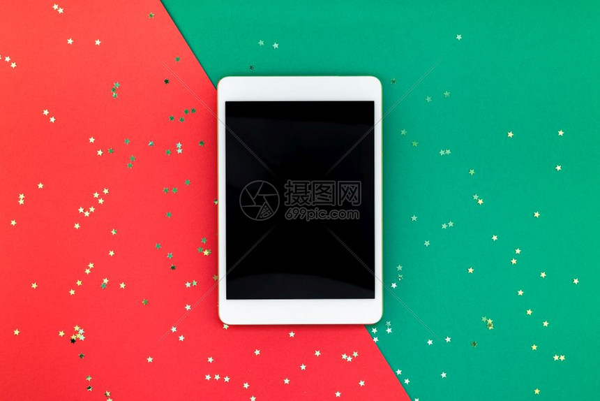 喜庆的嘲笑创新年或圣诞平板电脑模型式公寓最顶层的视野红绿纸背景模版2019年上的Xmas节庆祝活动移设备IpadIpad庆典图片