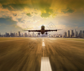 旅游利用城市摩天大楼的背景从机场跑道上搭乘客机速度快地图片