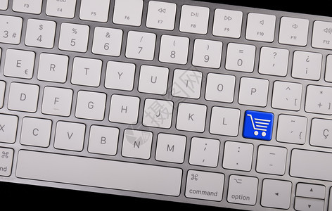 买金融互联网计算机笔记本键盘带有关于电子商务键概念的图标购物车图片