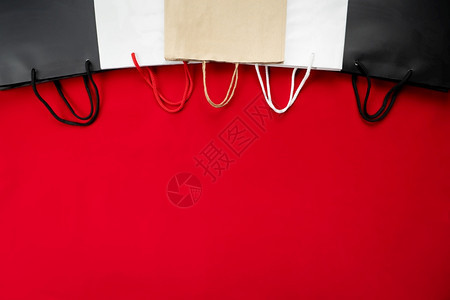 节日黑色周销售红底购物袋价格提供图片
