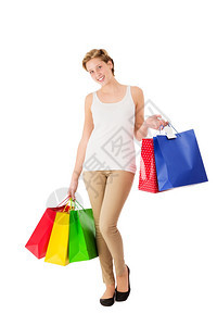 吸引人的携带肖像快乐购物袋年轻女子带着白色背景的购物袋图片