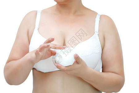 皮肤治疗穿着白内裤的女子拿着一罐白奶油健康图片