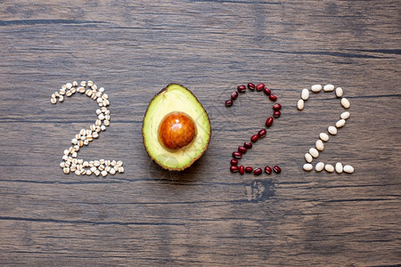薏苡仁酮卫生保健20年新快乐和你有水果蔬菜Avocadoadlay和Bean在会议目标健康动力决议时间到新开端饮食和世界粮日概念图片
