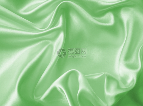 或者海浪平滑优雅的绿色丝绸或纹质可用作背景浪漫的图片