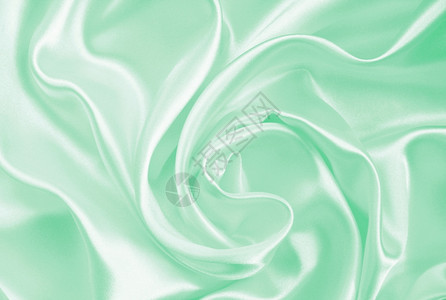 平滑优雅的绿色丝绸或可以用作背景美丽的折叠蓝色图片