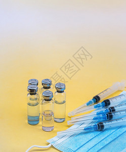 疫苗接种俄罗斯生物化学注射剂和药物医用安瓿和面罩注射器安瓿黄色背景注射剂和药物图片