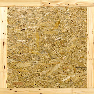 粮食面向的木制板由按压砂状棕褐色木材剃须制作为背景调查的结实控制板图片