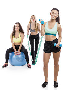 竞技微笑白种人健身房里三个漂亮运动女孩的肖像图片
