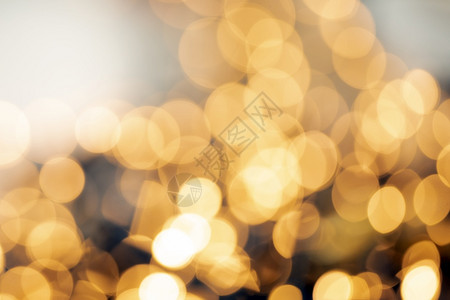 散焦金光抽象圣诞节或假日背景纹理闪发光的黄色模糊暖调彩散焦金光抽象圣诞节或假日背景纹理闪发光的黄色模糊暖调金子灰尘模糊的背景图片