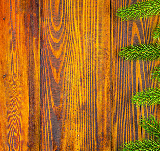 圣诞装饰框架概念背景在自然生锈的木质桌顶面与fir树枝接壤的圣诞节边缘处带有复制空间的顶层视图最佳天优质的图片