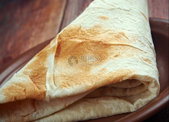 浪马军沙威玛Markook在LevantYufka常见的扁面包是土耳其它是一种薄圆和无叶的平面包与熔岩类似沙拉三明治图片