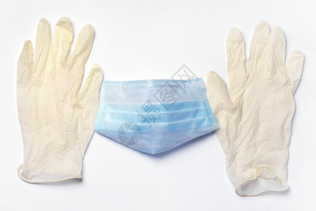 生病的呼吸器灰色背面的蓝保护医疗面具和白手套象征图片