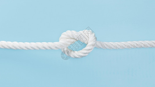 速度户外画高清晰光照白固态绳子和结的白色实状绳子优质照片图片