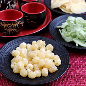 丰富多彩的春节甜果酱是新年月球上的传统食物可以用甜土豆莲花种子姜汁加糖越南习俗背景多彩等制作注TetFoodforTet假日在春图片