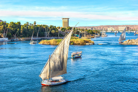 埃及阿斯旺尼罗河帆船日落运输蓝色的旅游图片