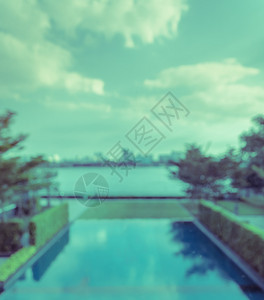 对抽象的河边模糊游泳池和城市风景背的美进行精观察虚拟过滤效应游泳的出去酒店图片