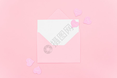 情书粉红色信封与白空卡和心在粉红色背景顶视图平躺样机为您的文本情人节母亲妇女贺卡情书粉红色信封与白空卡和心在粉红色背景顶视图平躺图片