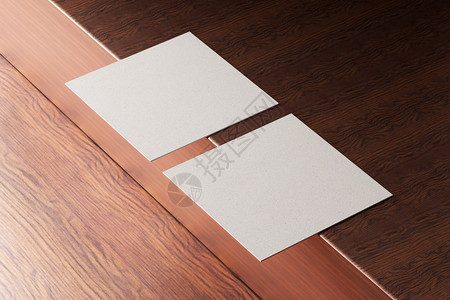 信在木棕色桌背景上用白方形纸商务卡模型制作木棕色桌背景的品牌展示模板打印图形设计2张卡模拟3D插图营销品牌推广图片