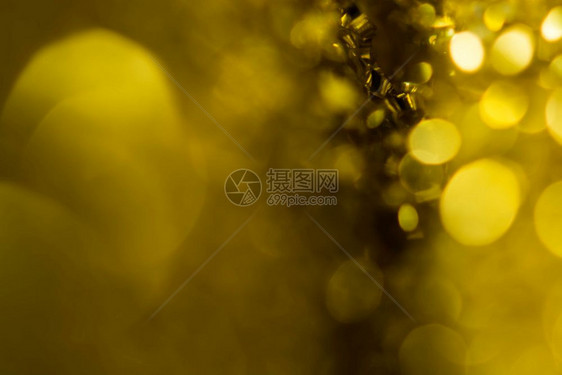 黄金天或夏圣诞闪烁背景花月的抽象纹理辉光金子花环图片