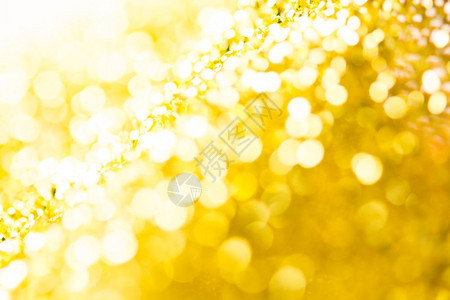黄金天或夏圣诞闪烁背景花月的抽象纹理棕褐色卡片抽象的图片