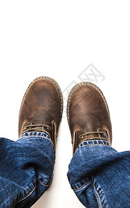 现代的模型Menrsqopos棕色靴子和蓝牛仔裤孤立在白色露地上的Menrschoos棕色靴子和孤立的蓝色牛仔裤时尚图片