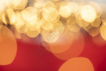 散焦迪斯科喜庆的金色和红散景背闪发光的颜色离焦圣诞假期概念闪发光的美丽金色和红散景背闪发光的颜色离焦圣诞假期概念闪发光的图片