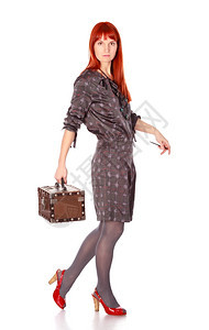 红色的鞋优雅奢侈女人用手提箱在白色上隔离图片