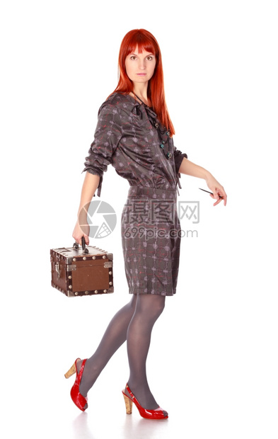 红色的鞋优雅奢侈女人用手提箱在白色上隔离图片