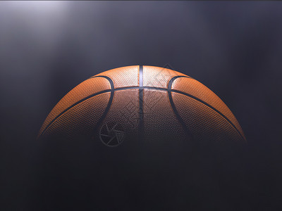 白色的细节黑暗篮球在色背景与聚光灯的Bokoh图片