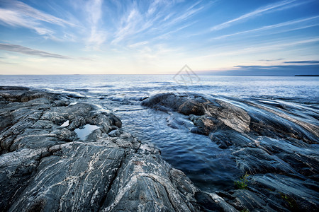 北岛日落时石质海岸部屿的石海岸天空著名的闲暇图片