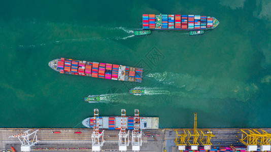 海全球的天线空中观察货船码头卸载起重机航空用集装箱和船舶观望工业港的集装箱和船只图片