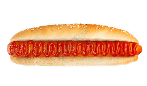 古典热狗配着番茄酱贴近的热狗孤立在白色背景上的美国人芝麻图片